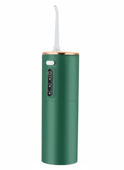 Green dental water flosser on a white background