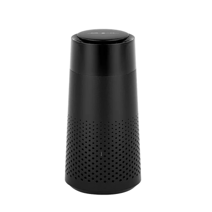 Black cylindrical device with perforated design on a white background